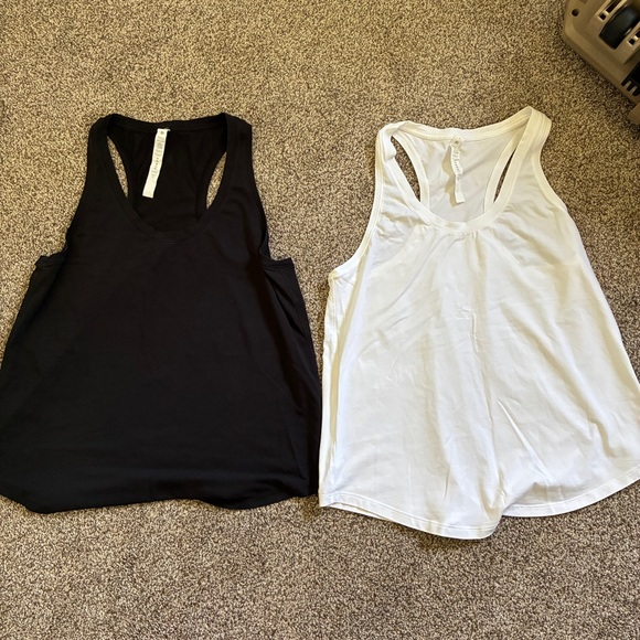 lululemon athletica Tops - Lot 2 Lululemon Athletica black and White Racerback Tank Tops size 8